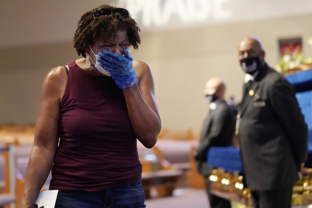 Mourner Charlene Thompson passes by the casket of George Floyd in Houston. Photo: AP