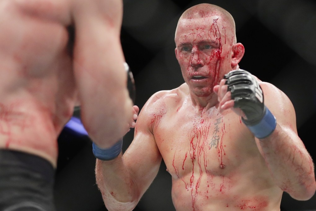 Georges St-Pierre faces Michael Bisping during a middleweight title bout at UFC 217. Photo: AP