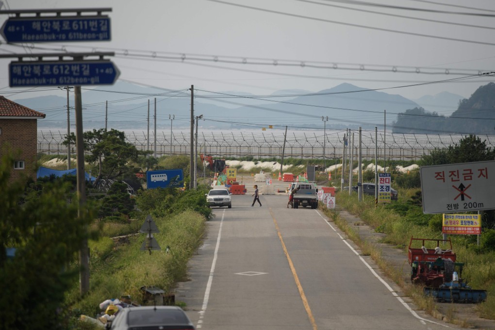 North Korean mountains are seen from the South Korean island of Ganghwa. Activists arrived on the island to release more than 100 plastic bottles into the sea to wash up further north, but were stopped by villagers on the island. Photo: AFP