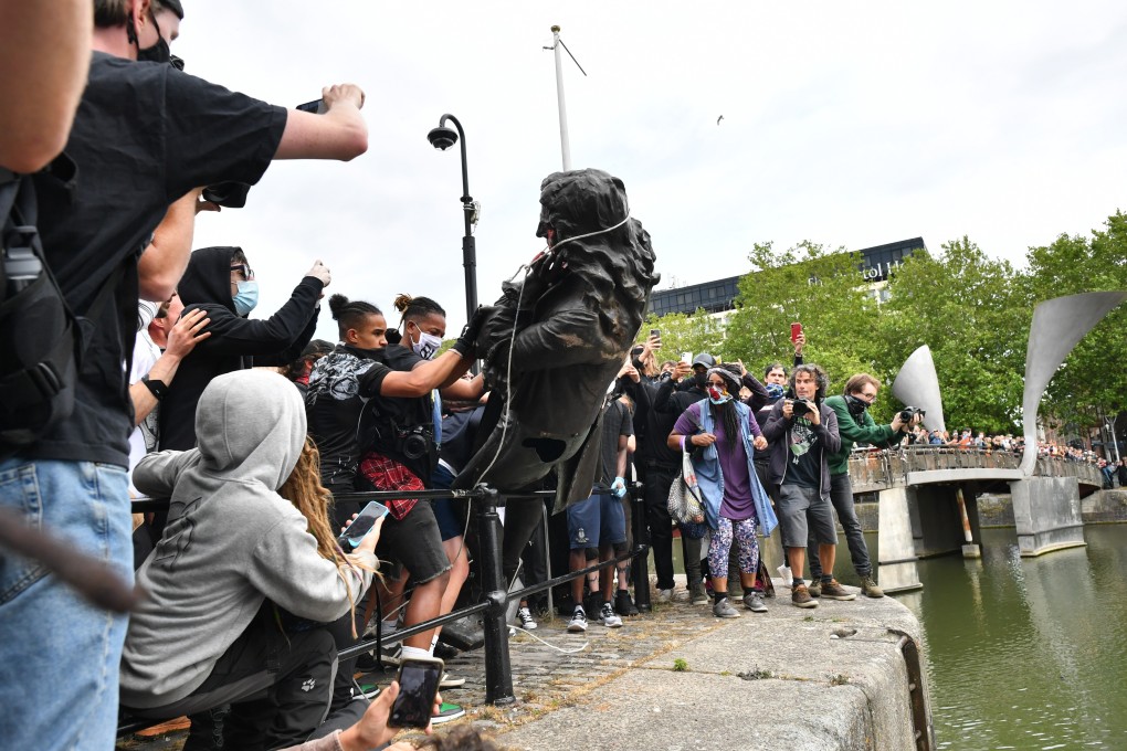 Protesters in Bristol pulled down and tipped into the harbour the bronze statue of Edward Colston. Photo: DPA