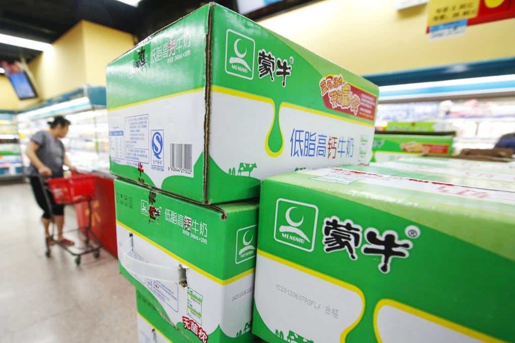 Boxes of Mengniu's milk products are seen at a supermarket in Beijing. Photo: Reuters