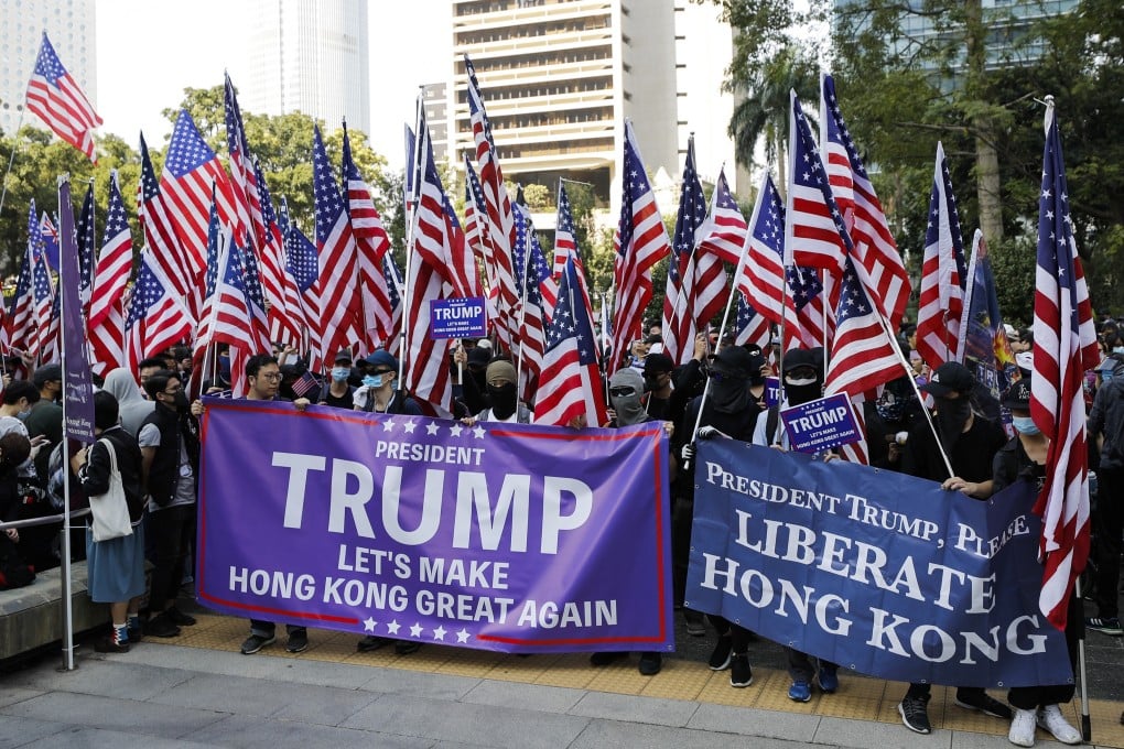 Hong Kong protesters carrying US flags and banners appealing to President Donald Trump for help prepare to march to the US Consulate during a rally in Hong Kong on December 1, 2019. Photo: AP