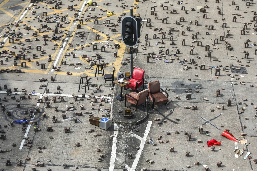 Anti-government protesters set up roadblocks with bricks dug up from pavements outside Baptist University in Kowloon Tong in November 2019. Photo: Xiaomei Chen