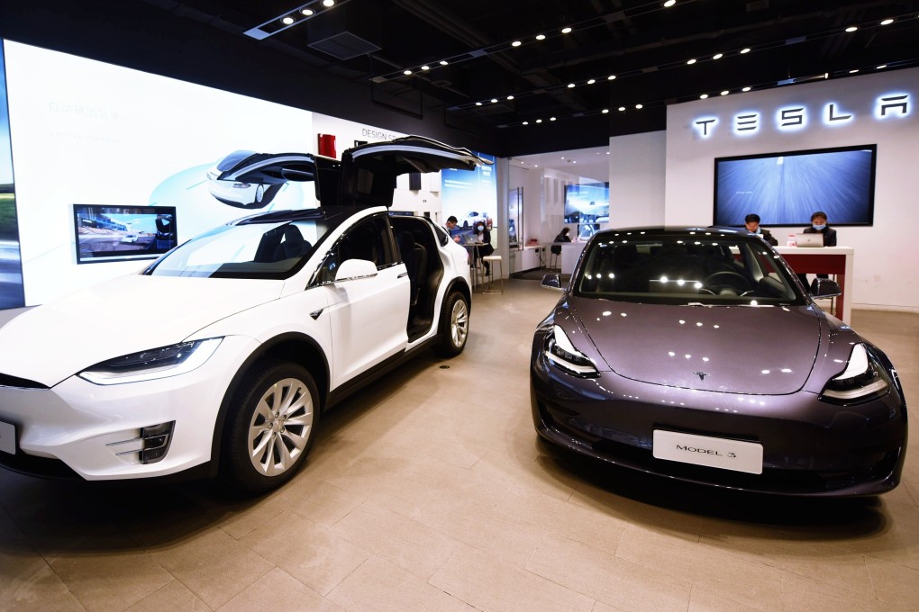 Tesla’s Model X electric sport utility vehicle with double-hinged gull wing doors, left, and its Model 3 car are seen on display at the company’s store in Hangzhou, capital of eastern China’s Zhejiang province, on April 21. Photo: Longwei/SIPA Asia via ZUMA Wire