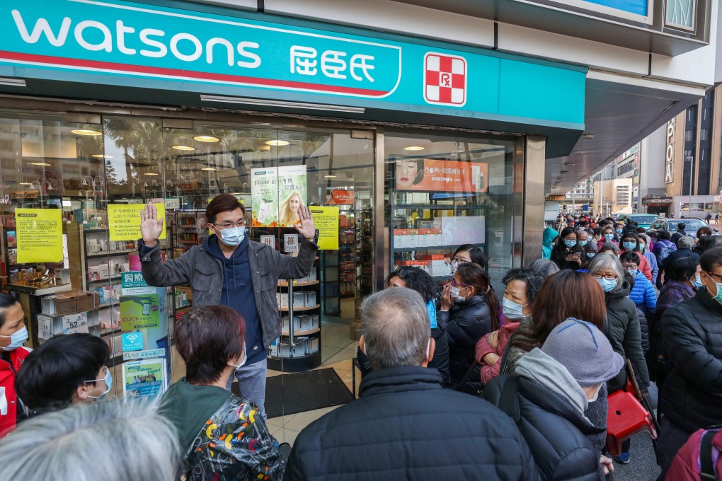 People queue outside Watsons for masks at a branch in Whampoa. Photo: Nora Tam