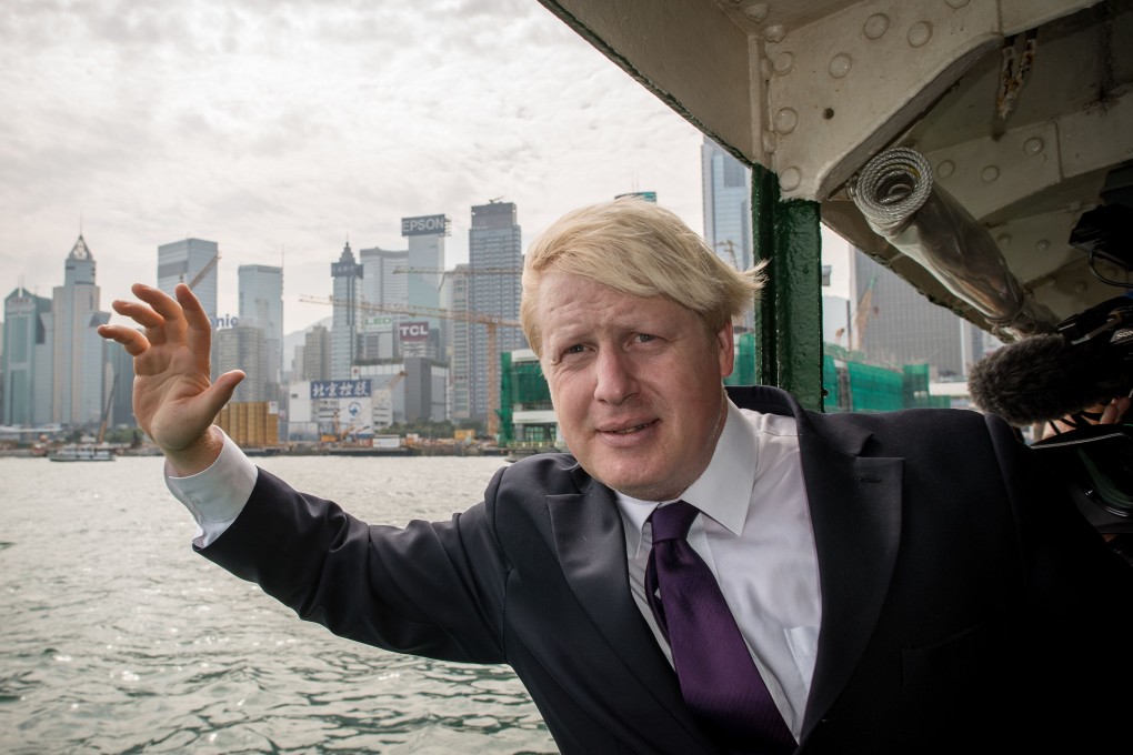 Boris Johnson, then mayor of London, waves as he crosses Victoria Harbour on the Star Ferry during his visit to Hong Kong in October 2013, while on the last leg of a trade mission to China aimed at promoting the British capital as a major investment destination. He took over as prime minister in July 2019. Photo: AFP