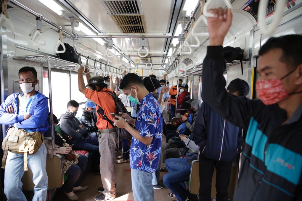 Passengers pictured on a commuter-line train in Bogor, Indonesia, on June 10. Photo: EPA