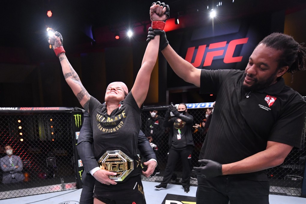 Amanda Nunes celebrates after her unanimous decision victory over Felicia Spencer in their featherweight championship bout during UFC 250. Photos: USA TODAY Sports