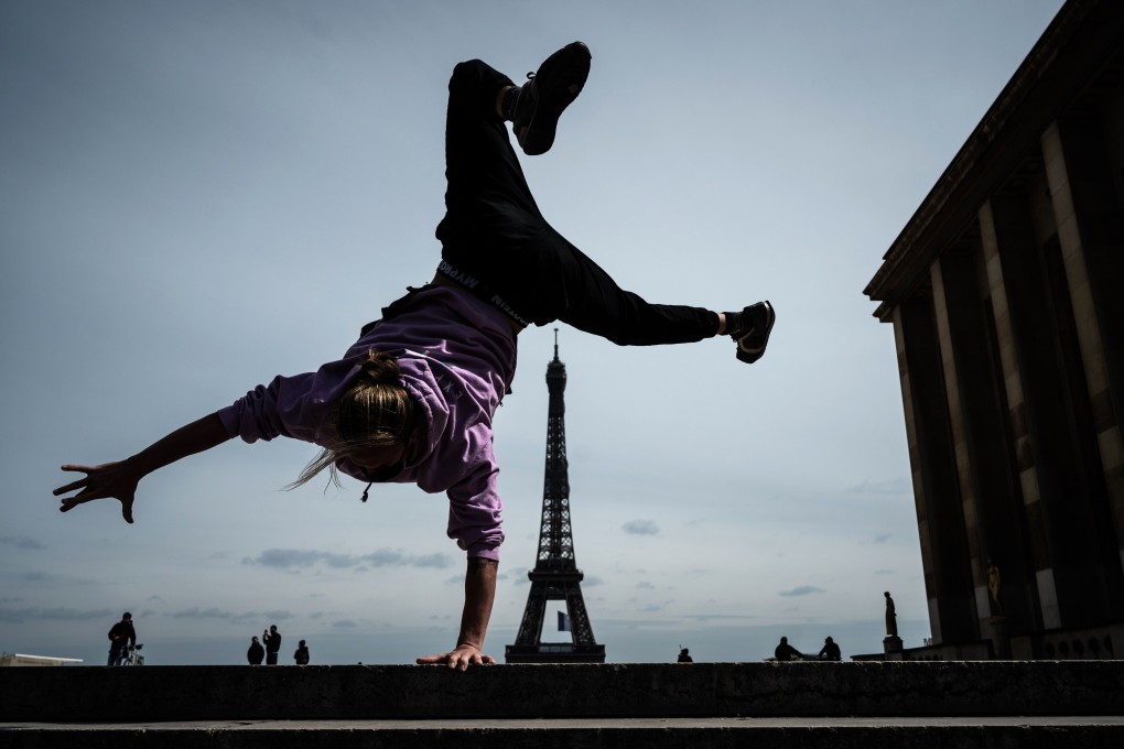 French freerunner Johan Tonnoir practises on Trocadero Plaza with the Eiffel Tower in the background in Paris on May 11, the first day of France’s easing of lockdown measures that had been in place for 55 days to curb the spread of Covid-19. Photo: AFP