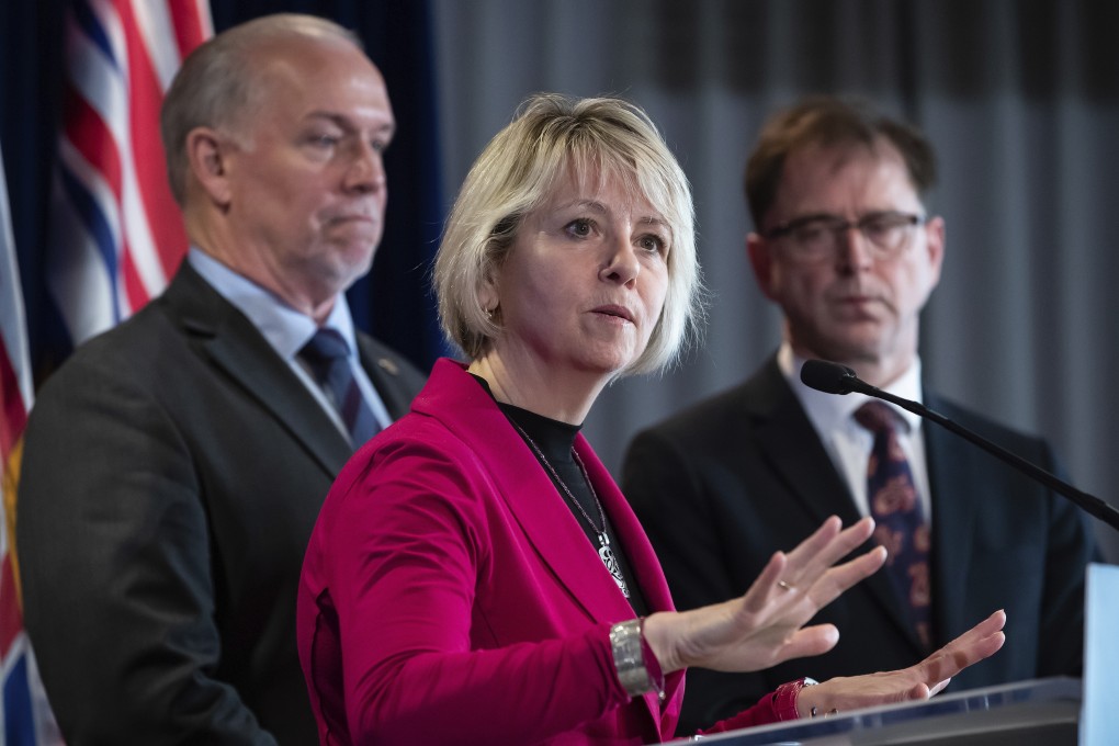British Columbia provincial health officer Dr Bonnie Henry responds to questions while British Columbia Premier John Horgan (left) and Health Minister Adrian Dix listen during a news conference in March. Photo: AP