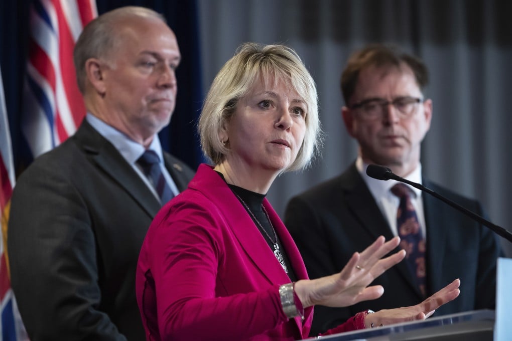 British Columbia provincial health officer Dr Bonnie Henry responds to questions while British Columbia Premier John Horgan (left) and Health Minister Adrian Dix listen during a news conference in March. Photo: AP
