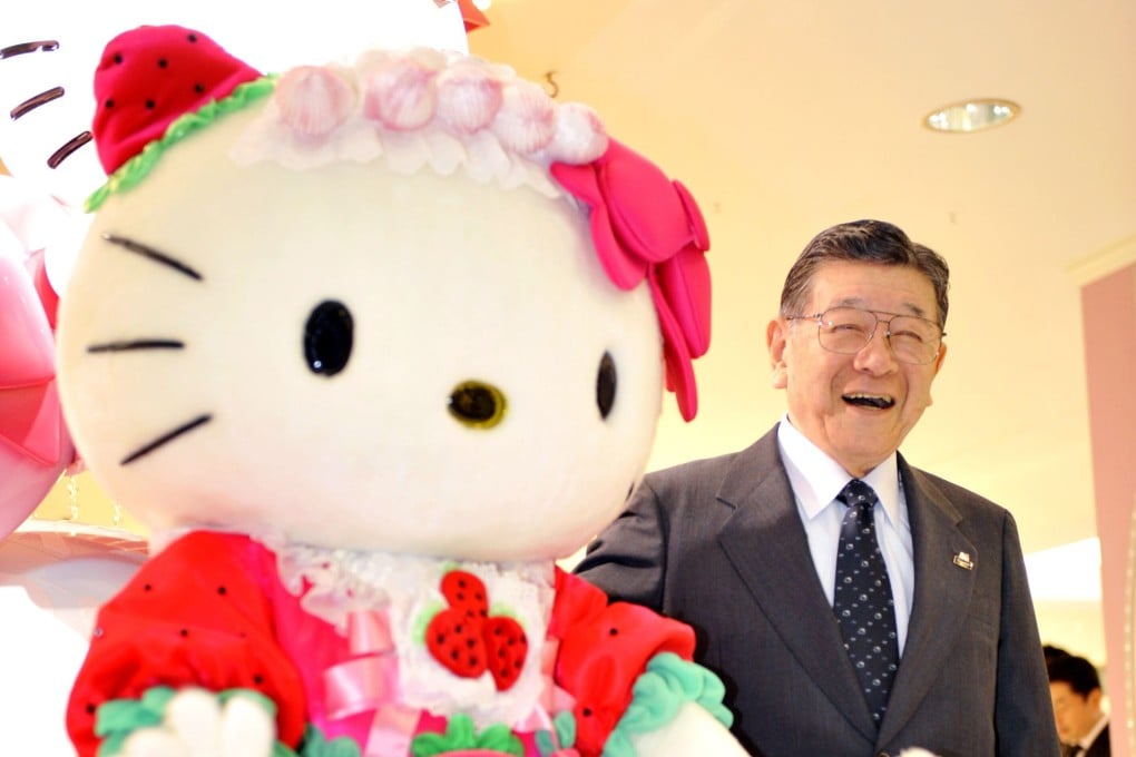 Shintaro Tsuji poses with character Hello Kitty in Tokyo. Photo: AFP