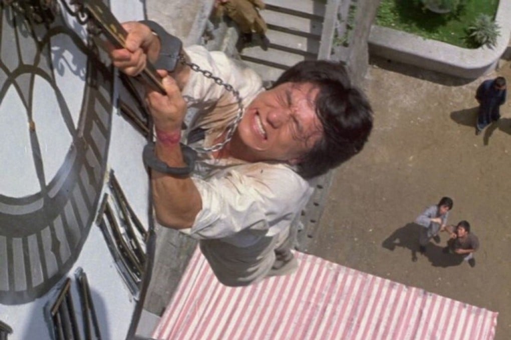 Jackie Chan in the scene from 1983 film Project A where he leaps from a 22-metre clock tower. He performed the stunt three times – twice successfully, which he used in the film as a double cut – and a third time unsuccessfully, bouncing onto the ground, which ran after the end credits. Both became signature practices in his films.