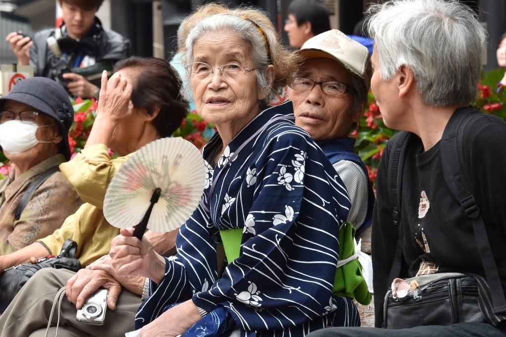 Elderly residents rest in the grounds of a temple in Tokyo. Japan suffers from a shortage of carers and an ageing population. The solution the country's come up with: wearables, sensors and data that can help people look after their older clients remotely. Photo: AFP