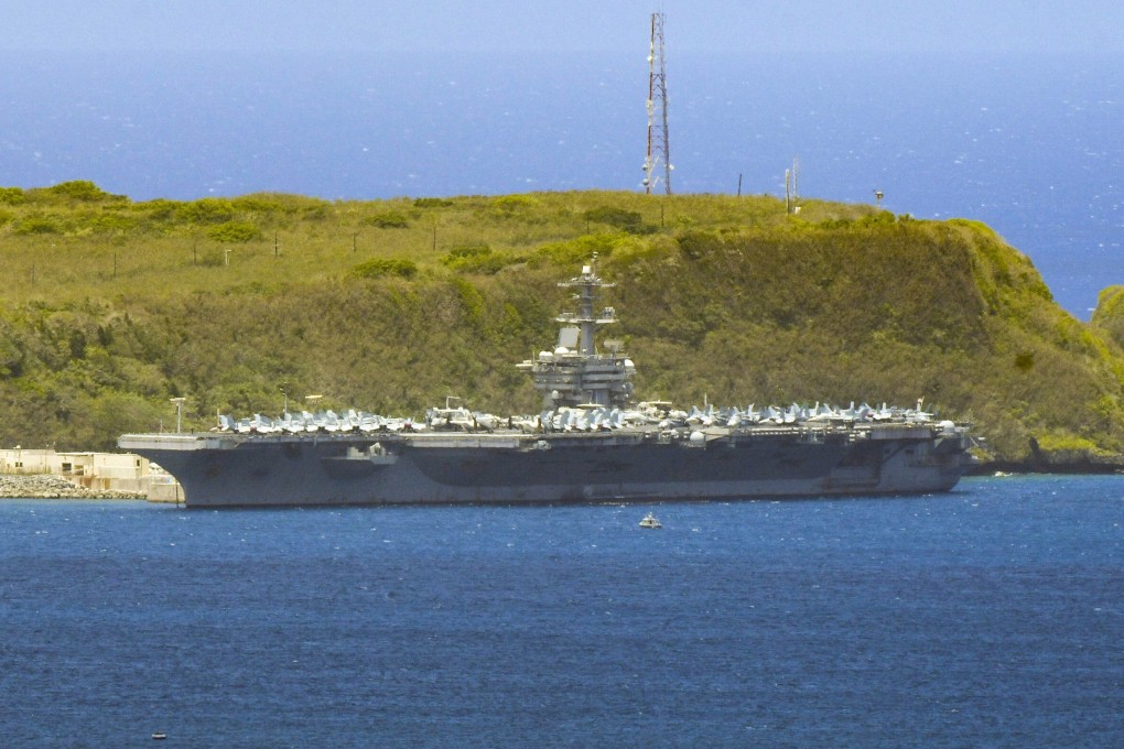 The USS Theodore Roosevelt is seen docked along Kilo Wharf of Naval Base Guam on April 3, 2020. Photo: The Pacific Daily via AP