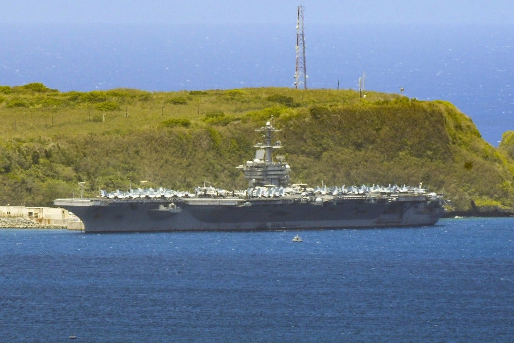The USS Theodore Roosevelt is seen docked along Kilo Wharf of Naval Base Guam on April 3, 2020. Photo: The Pacific Daily via AP