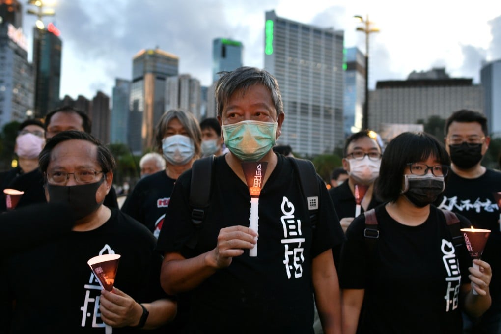 Lee Cheuk-yan (centre), chairman of the Alliance in Support of Patriotic Democratic Movements of China, is one of those facing prosecution over last week’s Victoria Park gathering. Photo: AFP
