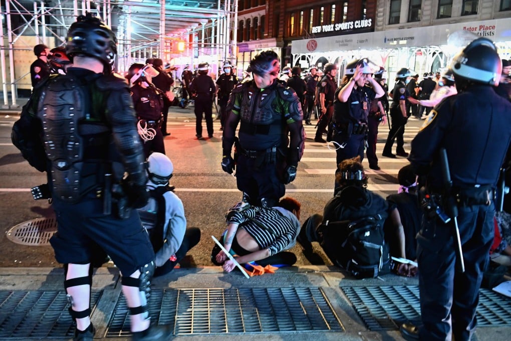 Police arrest people after looting in New York City. Photo: AFP