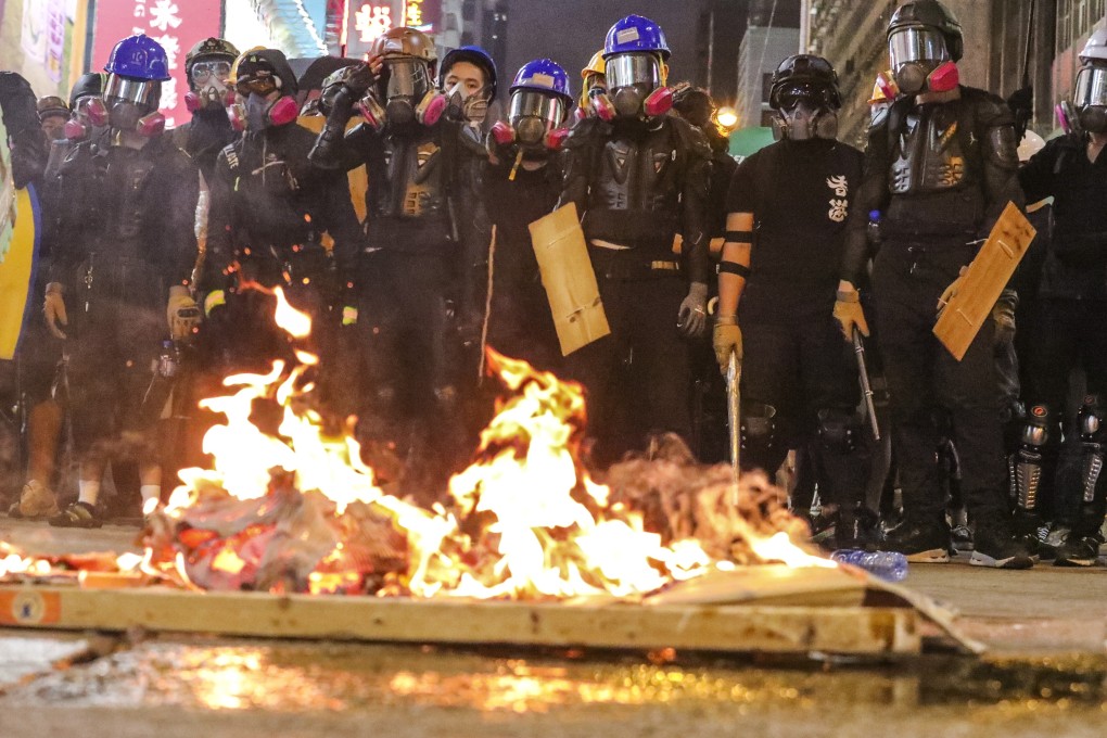 Radical protesters set a fire on Nathan Road in Mong Kok. Photo: Felix Wong