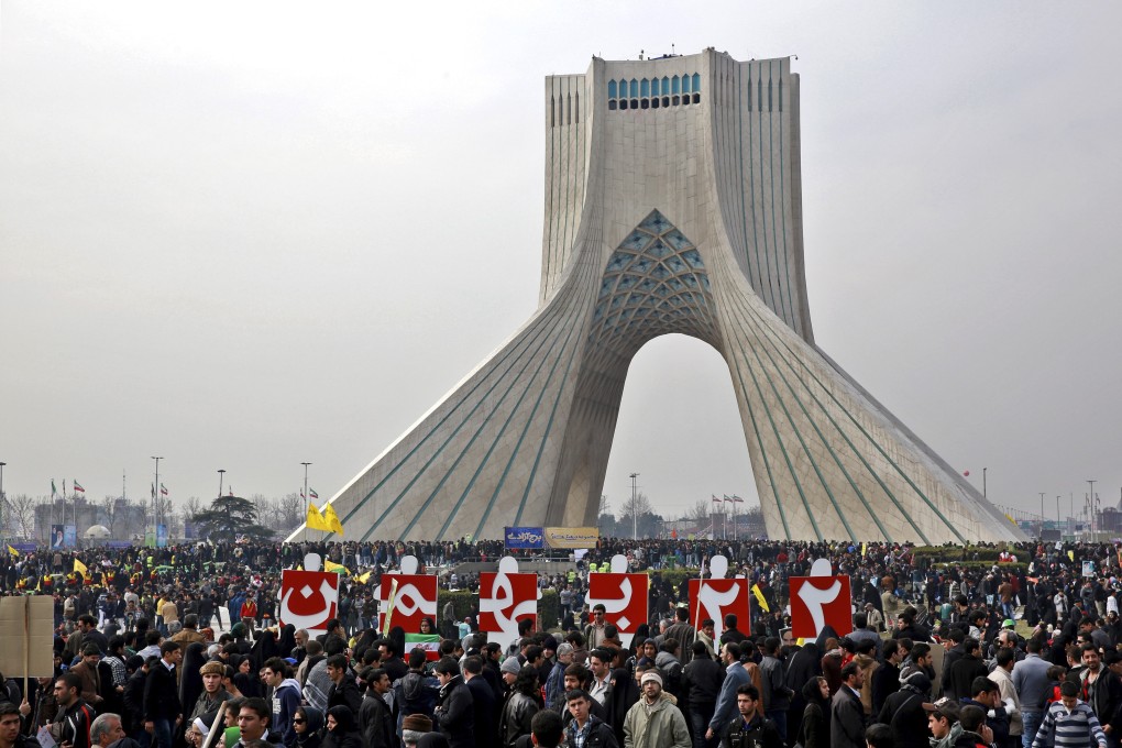 Iranians commemorate the 1979 Islamic revolution in Tehran in 2014. Photo: AP