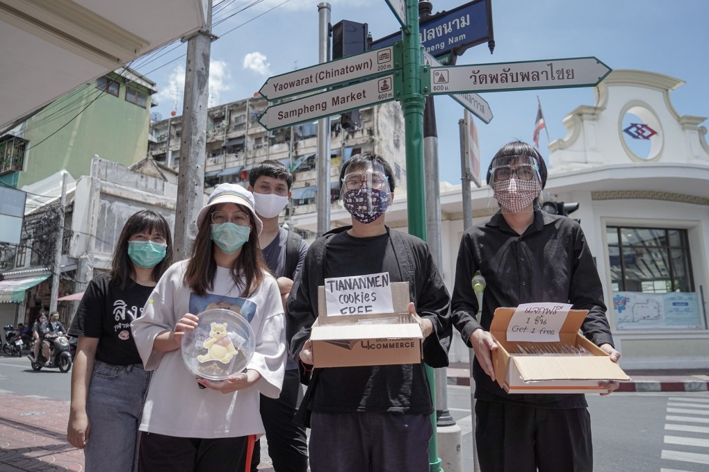 Netiwit Chotiphatphaisal and fellow Thai student activists distribute milk tea cookies in Bangkok's Chinatown to commemorate the anniversary of the 1989 Tiananmen Square crackdown. Photo: Twitter