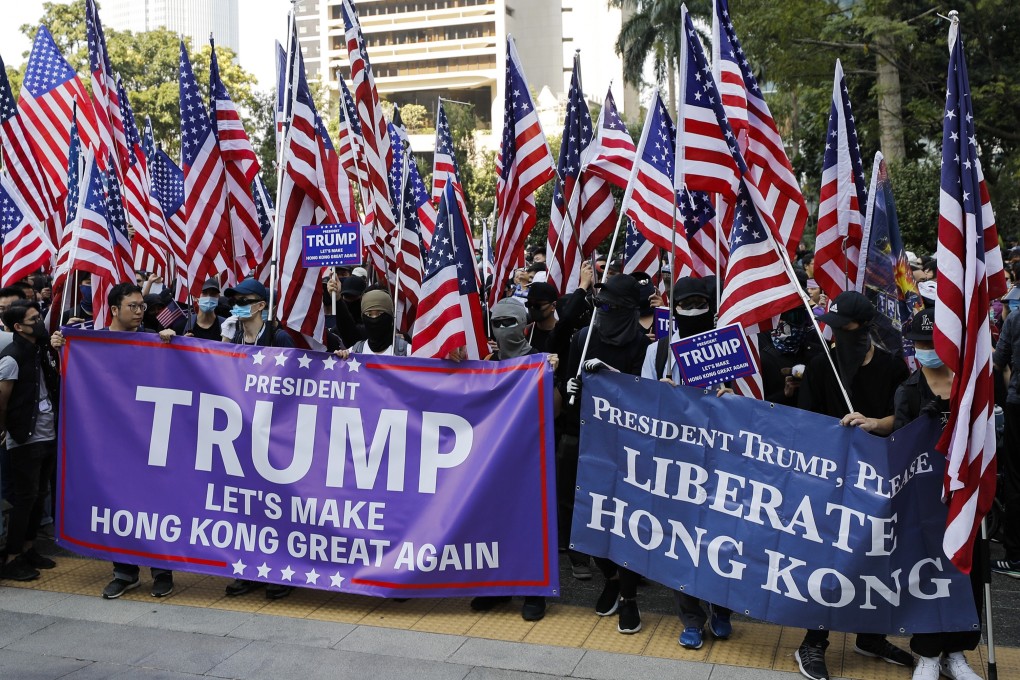 Protesters carrying American flags and banners appealing to President Donald Trump prepare to march to the US Consulate during a rally in Hong Kong on December 1 last year. Photo: AP