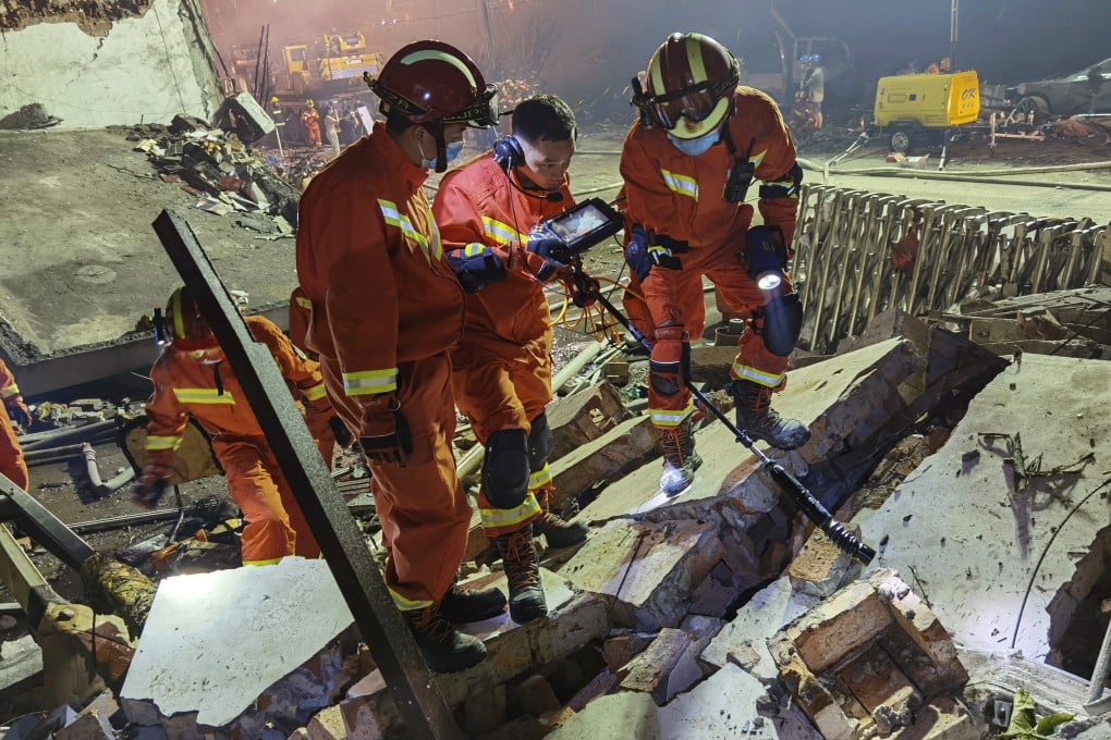 Firefighters look for residents trapped in collapsed buildings in the aftermath of a tanker truck explosion near a highway in Wenling in eastern China’s Zhejiang province on Saturday. Photo: AP