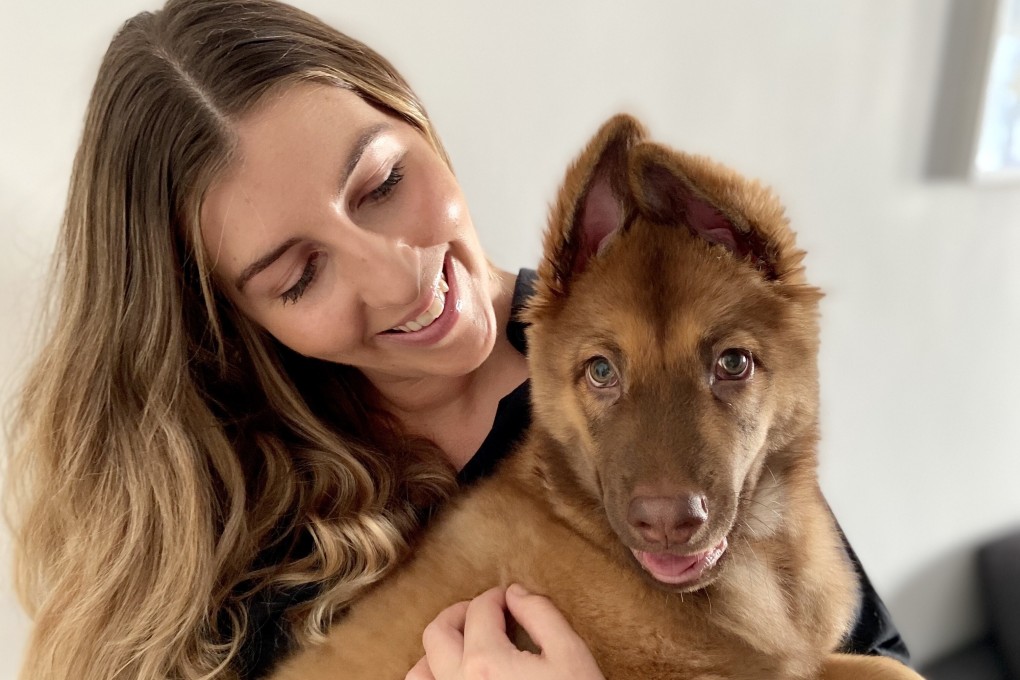 Jordanne Grey and Loki, who she adopted in Hong Kong along with her partner, after seeing a photo of him on Instagram. Loki is a mongrel, which means mixed bred, or ‘tong gau’ in Chinese. Photo: Handout