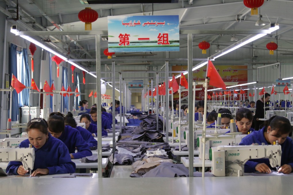 Uygur women work in a cloth factory in Hotan county, Xinjiang province, China. Nearly a quarter of the world’s raw cotton is turned into fabric in Xinjiang. Photo: Shutterstock