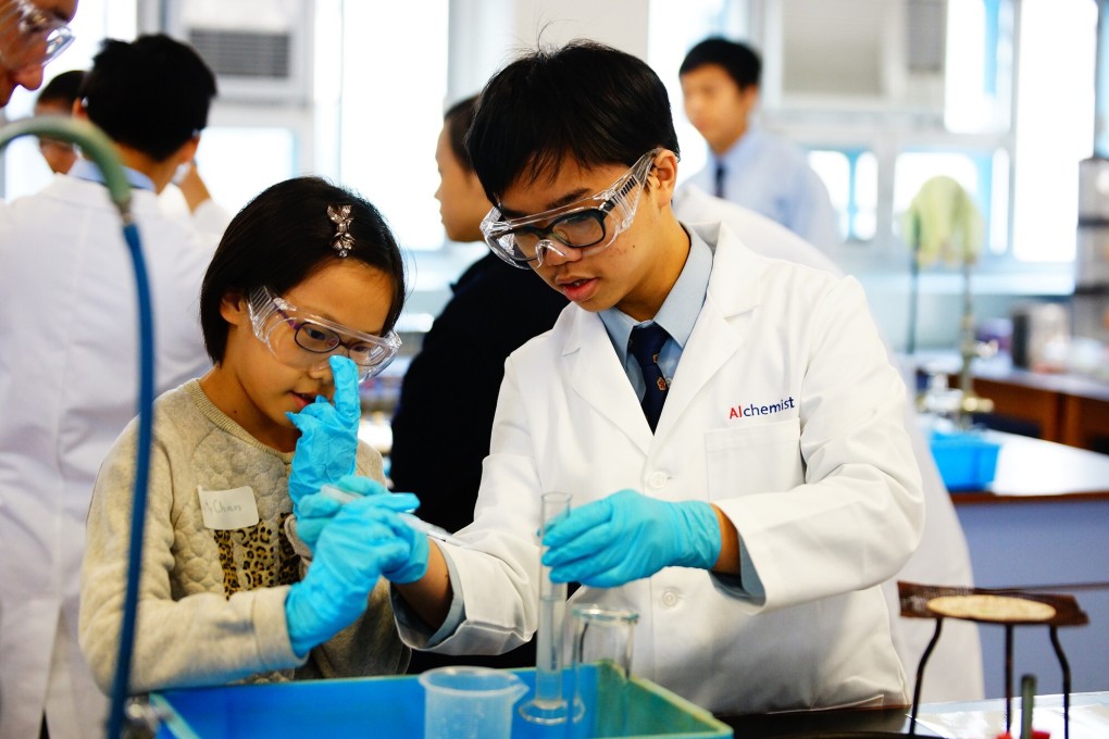 Children conduct a science experiment as part of an event at a secondary school in Ho Man Tin in December 2014. Photo: SKH Tsoi Kung Po Secondary School