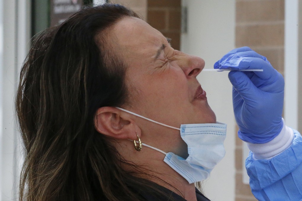 A woman receives a Covid-19 test. Scientists say they have a lot to learn about coronavirus immunity and how long people will be protected for. Photo: AP