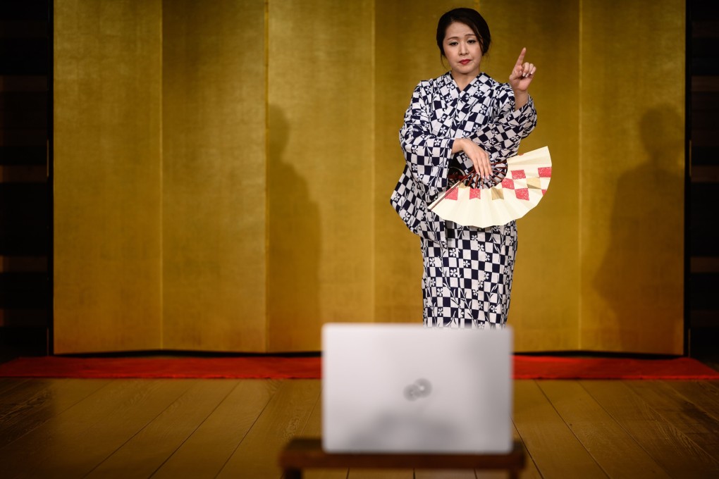 “Chacha”, a geisha who asked to be identified by a pseudonym, dancing during an online drinking party with clients. Photo: AFP