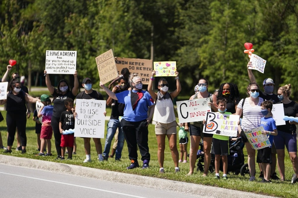 Children and families during a rally and short march in support of Black Lives Matter at Al Lopez Park, Tampa, Florida on Friday. Photo: Tampa Bay Times via ZUMA Wire/dpa