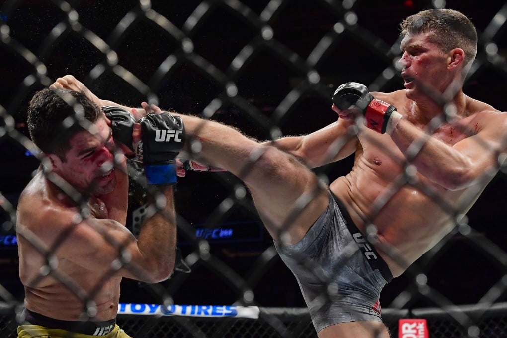 Stephen Thompson throws a kick against Vicente Luque in their welterweight bout during UFC 244. Photo: AFP