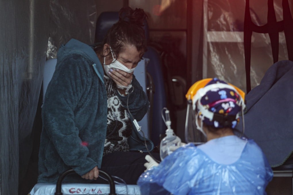A patient with respiratory distress receives aid from a medical worker in Santiago, Chile. Photo: AP