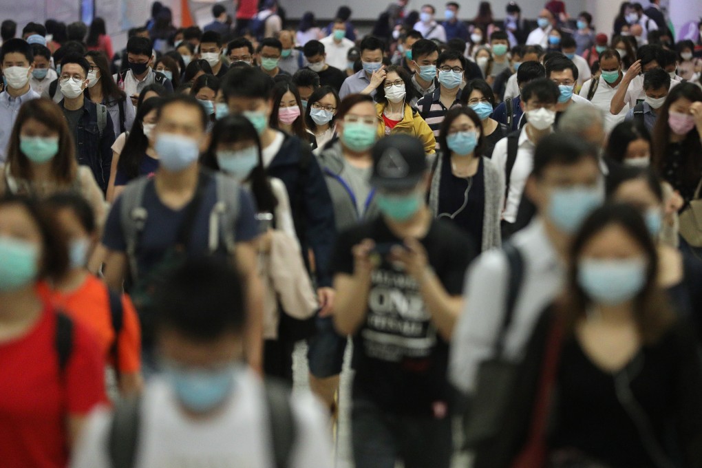 Commuters in face masks going to work at Hong Kong station in Central on April 21. Young people with jobs and those who are unemployed have both suffered economically during the Covid-19 pandemic and have mixed opinions about government programmes intended to help them. Photo: Winson Wong