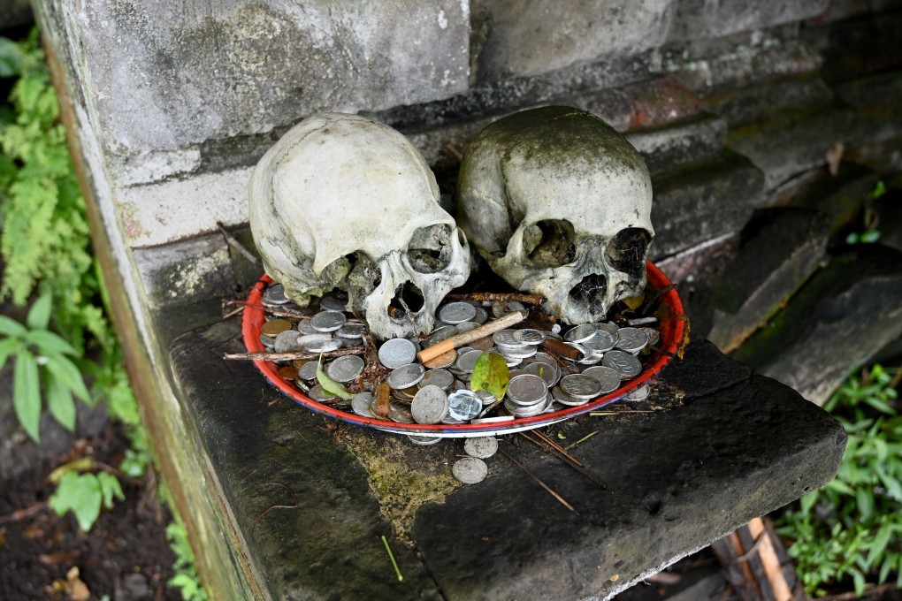 Skulls on display with offerings at a cemetery in Bali’s Trunyan village. Photo: AFP