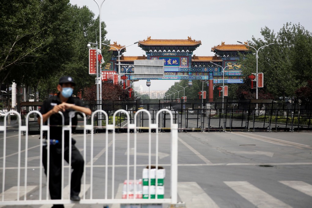 A security officer is seen outside the Xinfadi wholesale market in Beijing, which has been closed following an increase in coronavirus infections in China’s capital. Photo: Reuters