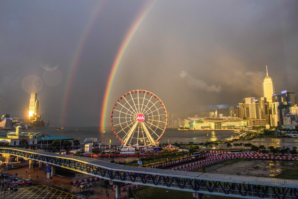 Two rainbows hang over Victoria Harbour in Hong Kong as the sun sets. Photo: AFP