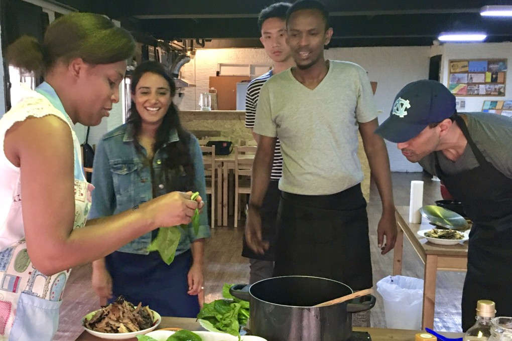 Elsie Zepho (left) teaches guests to cook Congolese food at the Africa Centre, in Tsim Sha Tsui. Photo: Chihiro Shimizu / Africa Centre Hong Kong