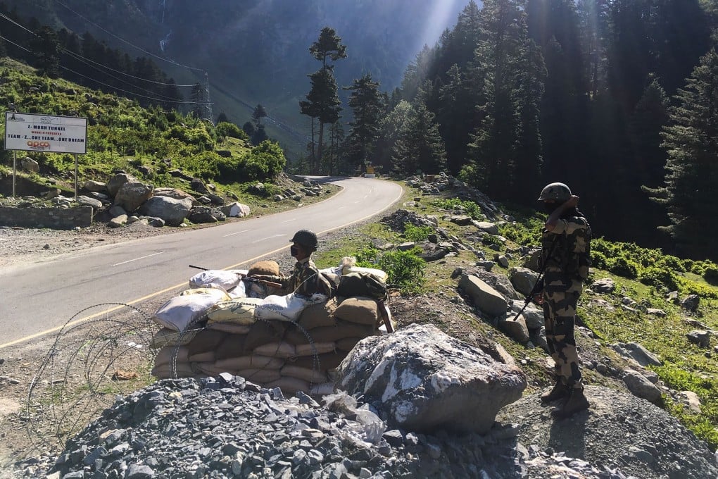 Indian Border Security Force soldiers guard a highway leading towards Leh, bordering China, in Gagangir on June 17. Photo: AFP