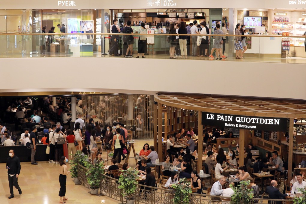 People take their lunch break at a restaurant in Pacific Place in Admiralty on Thursday. May Tse