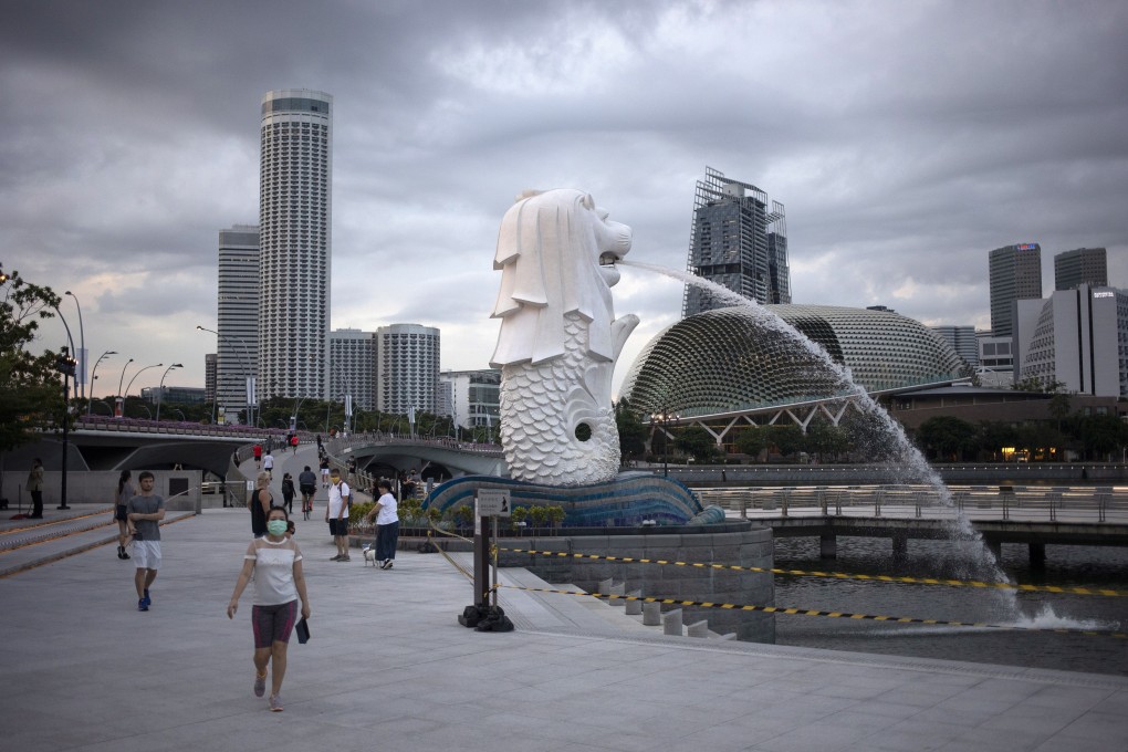 People walk through the Merlion Park in Singapore on June 11. The country has laws that empower the state to act against anyone who causes feelings of enmity between different religious groups. Photo: EPA-EFE
