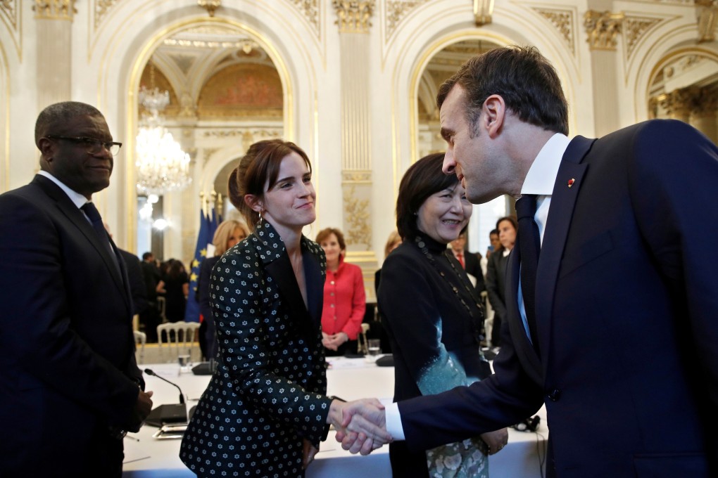 French President Emmanuel Macron greets British actress Emma Watson ahead of a meeting on gender equality at the Elysee Palace in Paris in 2019. Photo: Reuters/Pool