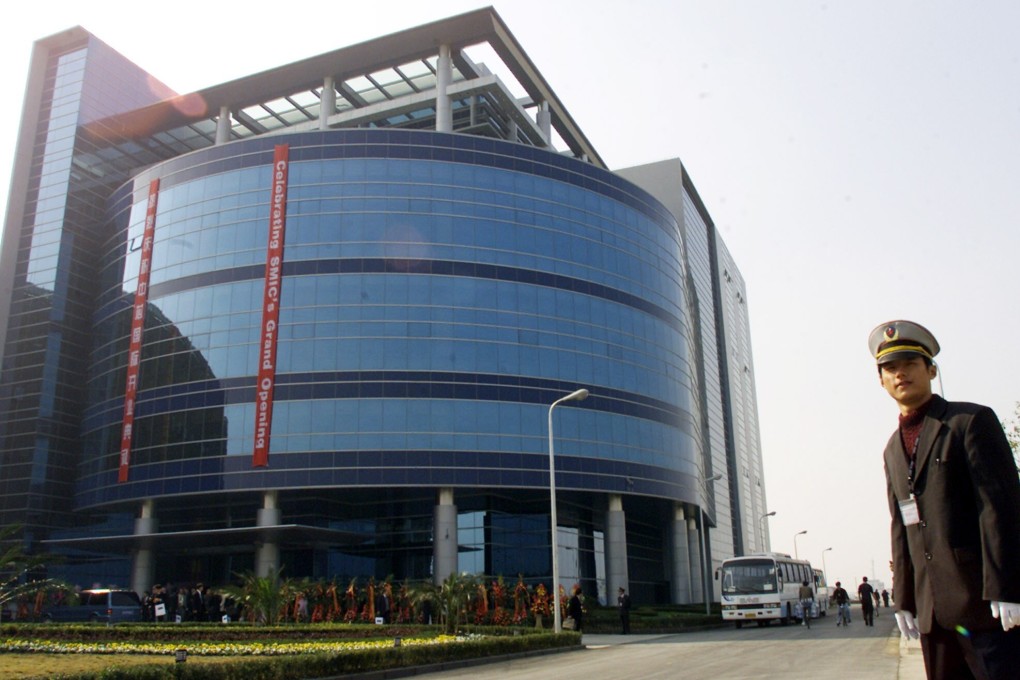 A security officer stands outside Semiconductor Manufacturing International Corporation headquarters in Shanghai when it was completed in November 2001. Photo: Reuters