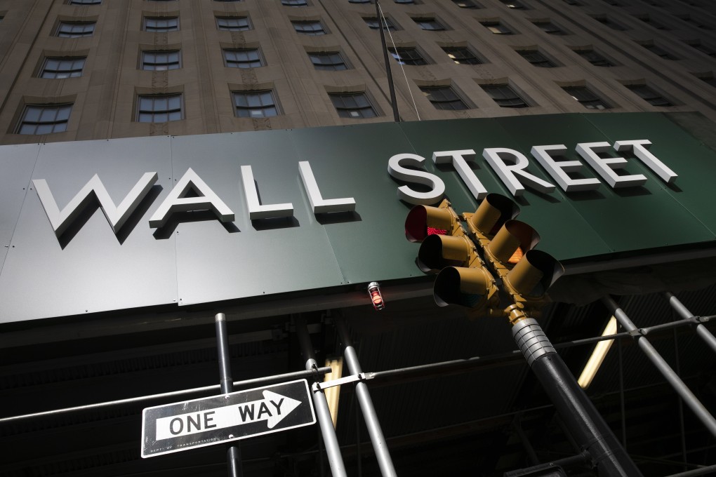 A sign for a Wall Street building is seen on June 16. Photo: AP