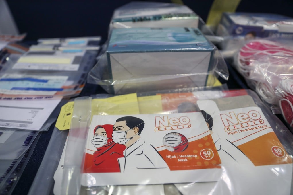 Hong Kong police arrested 31 people for cheating 400 victims out of more than HK$3 million in the latest operation against face mask scams, April 20, 2020. Photo: SCMP / Dickson Lee