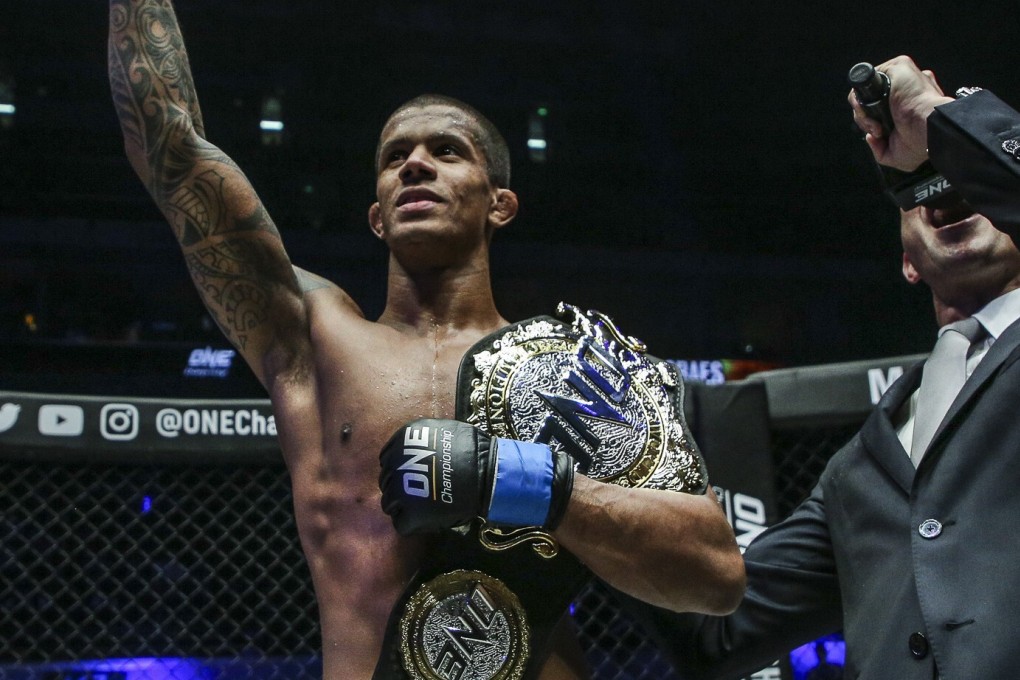 Adriano Moraes with his ONE flyweight title. Photos: ONE Championship