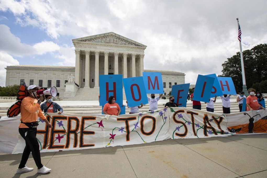 Deferred Action for Childhood Arrivals (DACA) recipient Roberto Martinez (left) celebrates with other DACA recipients in front of the Supreme Court on Thursday. Photo: AP Photo