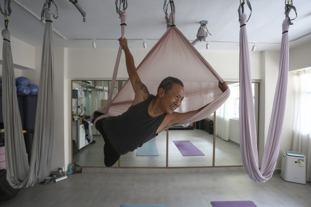 Dave Lau takes part in an aerial yoga session in Jordan, Hong Kong. At 75 years old, Lau is a great example of how staying active can give you a longer, healthier life. Photo: Jonathan Wong